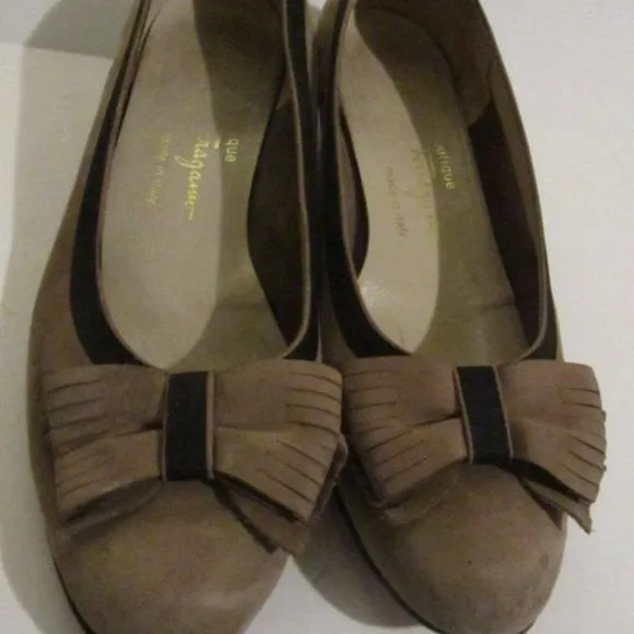 Salvatore Ferragamo VARA brown suede flats with black trim, large, fringe bows at the toes, and low, wedge heels